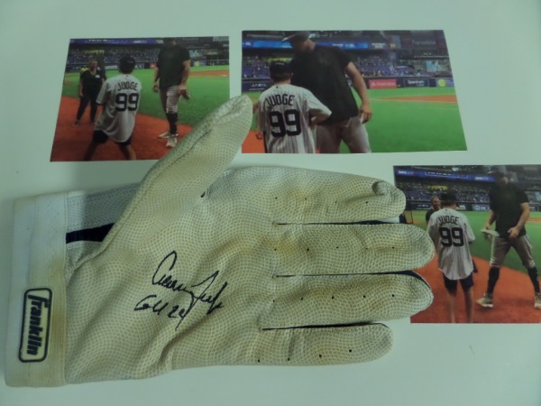 This historic NYY item is a real game used glove from this season, comes hand signed and written GU 2024 by Judge himself, and was given to our consignors son on the field by Judge pre-game. Cool piece, a HUGE Franklin glove, and with three color photos of the interaction. 