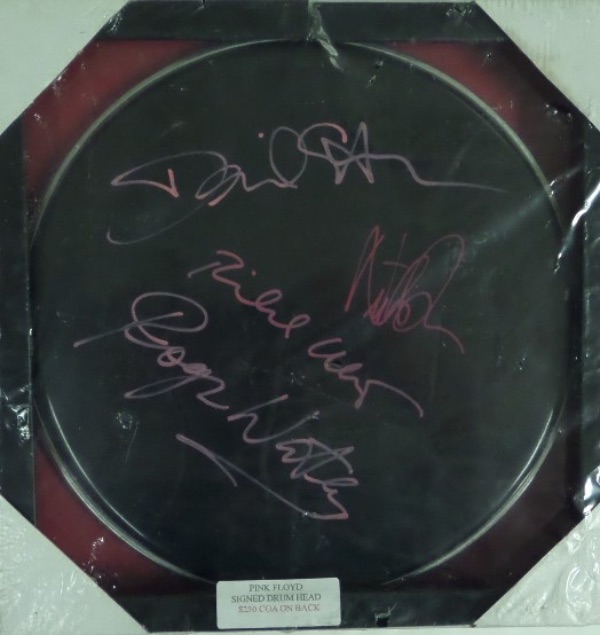 This $2500.00 piece of rock n roll memorabilia is a mint black drum head, about 10" round, and comes pink paint pen signed by Roger Waters, David Gilmour and the other 2 band mates. It grades a perfect 10 all over, comes with a lifetime COA, as well as custom wood framing for proper show off. Sold here with NO reserve, and from the 4th greatest band in rock history. 