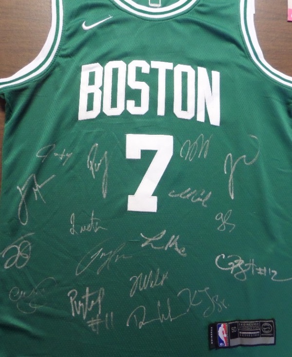 This green size 50 Boston Celtics #7 Brown jersey is from Nike, and comes tagged as new, with everything sewn.  It is front-signed in silver by more than 15 members of the reigning NBA Champion Celtics, including Brown, Tatum, Jrue Holiday, Al Horford, Kristaps Porzingis, Derrick White, and all the rest, and this first time offering here at CCSA is valued well into the low thousands, so get in on our Crazy Eddie minimum bid!