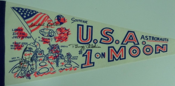 This 30" long "U.S.A. #1 on Moon" white pennant is still in EX+/NM condition overall, with an Apollo 11 logo, artist's images of the astronauts, and events listed by time.  It is hand-signed in black sharpie by all three, including Neil Armstong, Buzz Aldrin and Michael Collins, and retail on this gem is easily into the low thousands!