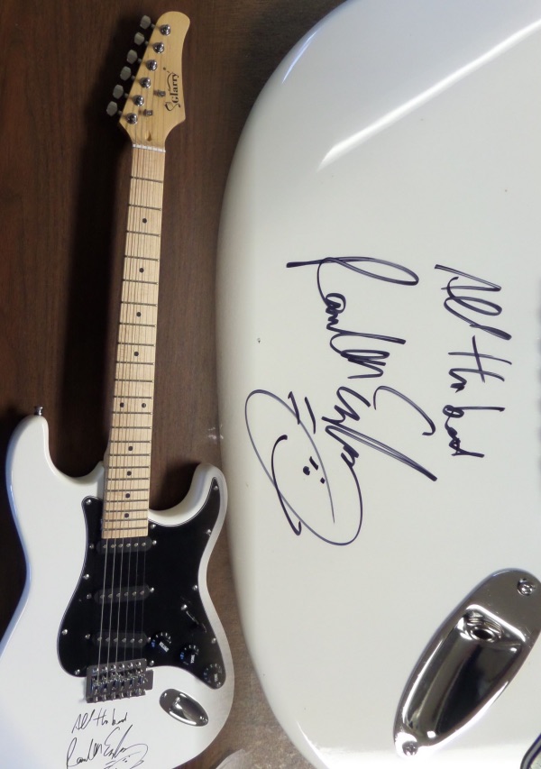 This gorgeous all white mint electric Glarry guitar comes with the original box, pick ups, bag, straps,etc. and comes signed by the best singer/songwriter of all time in black. SUPERB autograph and shows off wonderfully. Guaranteed authentic and get it now because Paul is a tough autograph and not getting any younger! He even included "All the best" above his tough-to-get signature!