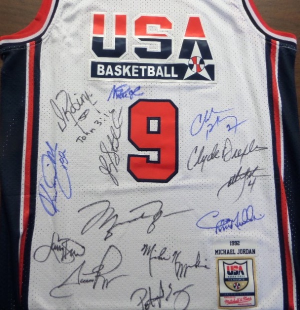 This white size 44 Mitchell & Ness #9 USA Basketball Michael Jordan jersey is like NEW, has everything sewn, and comes front signed in black or blue sharpie by all 12 members of the original Dream Team!  Included are Bird, Magic, Jordan, Barkley, Ewing, Drexler, Robinson, Malone, Stockton, Pippen, Laettner, Mullin, and even assistant coach, and NCAA legend, Mike Krzyzewski, and this AWESOME and one of a kind display item books well into the low thousands!