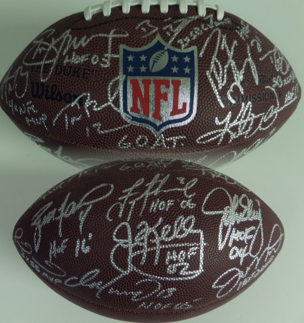 This amazing NFL item is a NM full size Wilson NFL football, hand-signed in bright silver by 14 of the greatest quarterbacks to ever take a snap!  Included are Brady, Marino, Brees, Young, Roethlisberger, Manning, Warner, Rodgers, Favre, Aiklman, Elway, Montana, Kelly and Mahomes, and each and every passer has added an inscription to boot!  AWESOME collector's item, and retail is low thousands all day long!