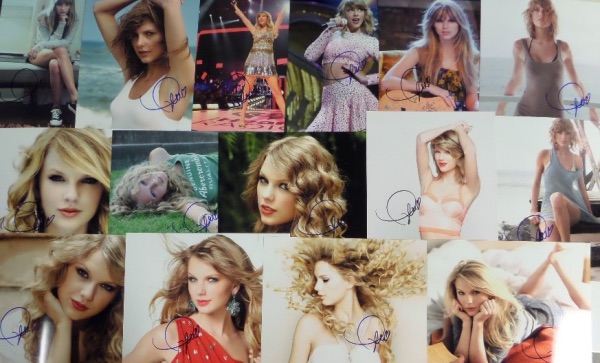 This ideal group lot is FIFTEEN full color 8x10 photos, including different shots, each hand-signed by the superstar pop/country singer.  Each photo can retail into the hundreds with the huge popularity of Swift, so you do the math with FIFTEEN!!!