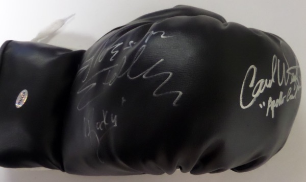 This mint black 14 ounce lace-up glove comes signed by the 2 stars of this all-time classic flick. Both have signed wonderfully in silver with Carl including "Apollo Creed" and Stallone "ROCKY"!  Retail was in the mid hundreds and now rising with the recent passing of Carl Weathers.  Hologrammed and guaranteed authentic. 