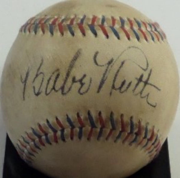 This Babe Ruth Home Run Special beautiful red and blue-laced baseball from Spalding is very old but still in VG overall condition.  It is hand-signed on the sweet spot in black fountain pen ink by The Bambino himself, his signature grading an overall 6.5-7, and with Ruth's death now more than 75 years back, retail is FIVE FIGURES on this gem!