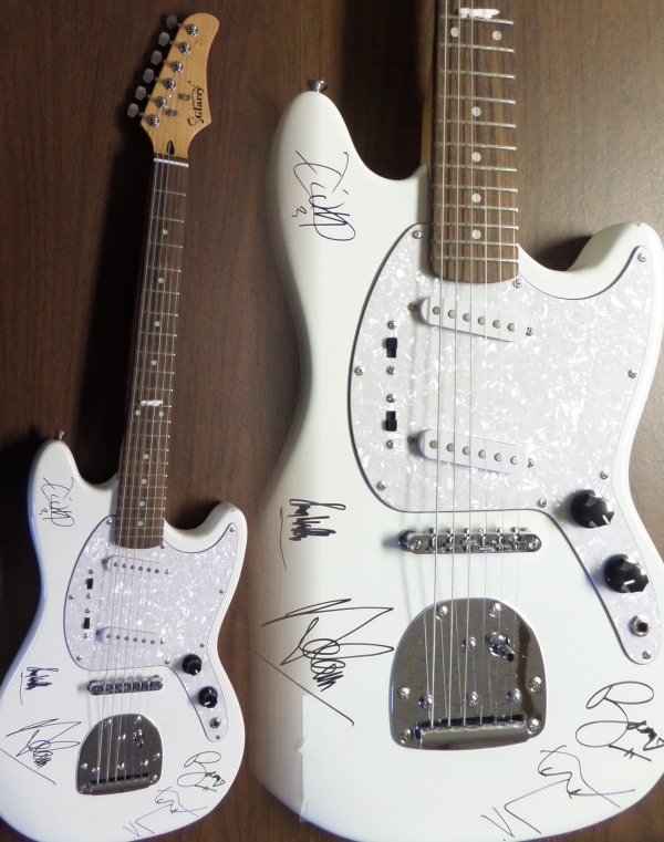 This STUNNING mint white electric beauty comes in box with original carry bag, straps,etc.  It comes signed perfectly in silver by ALL 4 guys with a great personal portrait of his face by Bono.  Also included are Adam Clayton, Larry Mullen Jr. & the Edge.  Guaranteed authentic and retails into the thousands easily.