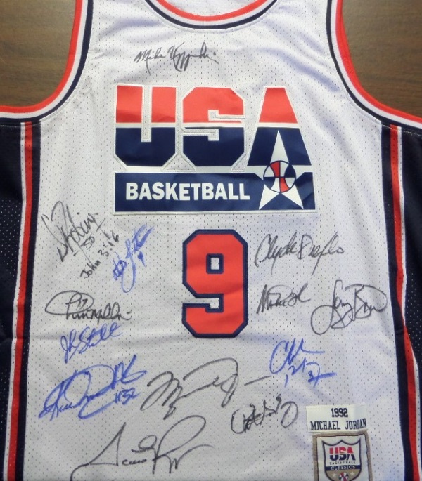 This white size L Mitchell & Ness #9 USA Basketball Michael Jordan jersey is like NEW, has everything sewn, and comes front signed in blue or black sharpie by all 12 members of the original Dream Team!  Included are Bird, Magic, Jordan, Barkley, Ewing, Drexler, Robinson, Malone, Stockton, Pippen, Laettner, Mullin, and even assistant coach, and NCAA legend, Mike Krzyzewski, and this AWESOME and one of a kind display item books well into the low thousands!