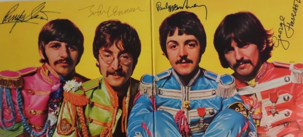 This vintage 1967 "Sgt. Pepper's Lonely Hearts Club Band" LP album is in EX overall shape, and opens to an image of The Fab Four against a yellow background.  It comes ink signed by John Lennon, sharpie signed by Paul McCartney, Ringo Starr and George Harrison, and looks absolutely GORGEOUS!!!  Retail is well into the thousands!