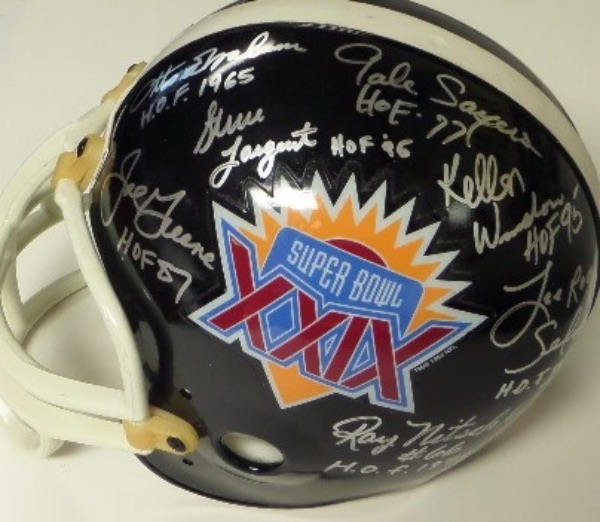 You're going to want to get in on this NFL item, because, to be honest, there can't be many of them out there.  It is a Super Bowl XXIX logo full size helmet from Riddell that comes hand-signed in silver by all 7 all time greats who participated in that Super Bowl's coin toss.  Included are Ray Nitschke, Lee Roy Selmon, Joe Greene, Gale Sayers, Kellen Winslow, Steve Largent and Otto Graham!  All seven are enshrined in Canton, and more than half are now deceased, and every signature is on one side of the helmet for optimal display value.  Retail is well, WELL into the thousands!