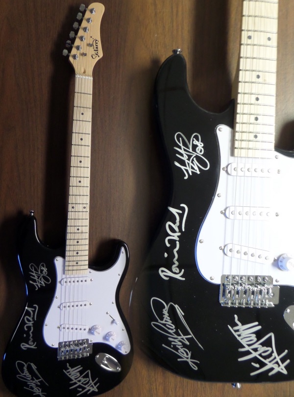 This beautiful black Fender Stratocaster style electric guitar is in MINT condition, and comes hand-signed in silver by all four longtime members of the world's most recognizable rock band, The Rolling Stones.  Signatures are bright, and each grades a legible 8.5 at least.  Included are Ron Wood, Mick Jagger, Charlie Watts and Keith Richards, and with Watts' recent passing, the already sky-high retail value of this baby shoots ever upward!