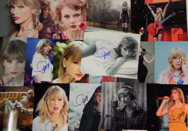 This ideal group lot is SIXTEEN full color 8x10 photos, including concert shots, poses, and all kinds of colorful images, each hand-signed by the superstar pop/country singer.  Each photo can retail into the hundreds with the huge popularity of Swift, so you do the math with SIXTEEN!!!