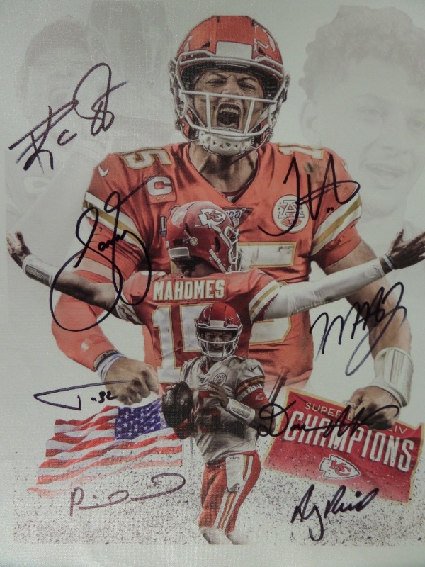 This Patrick Mahomes KC Chiefs color litho print is done on an actual canvas, measuring 19x23 in size, and in NM condition.  It is hand-signed by 8 different Chiefs that helped to attain the team's first Super Bowl victory in 50 years, including Mahomes, Andy Reid, Travis Kelce, Tyreek Hill, Tyran Mathieu, Sammy Watkins, and two others--please refer to our photo.  Retail is low thousands!