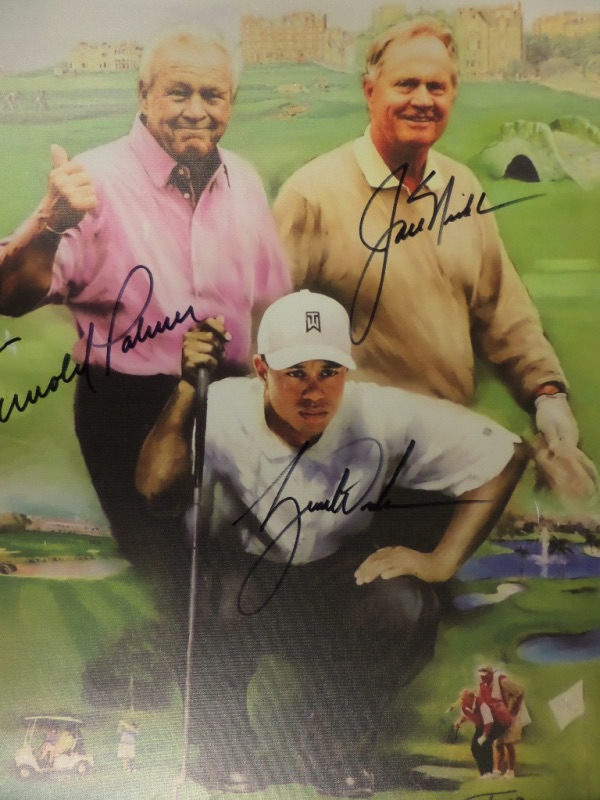 This artist's litho print is done on canvas, wrapped around an inner wooden frame, and in NM condition.  It is a full color image of three golf greats, with the Ancient Golf Club at St. Andrews in the background, and comes hand-signed by three of the greatest golfers of all time, including Tiger Woods, Arnold Palmer, and the greatest of them all, the one and only Golden Bear, Jack Nicklaus!  Valued into the low thousands!