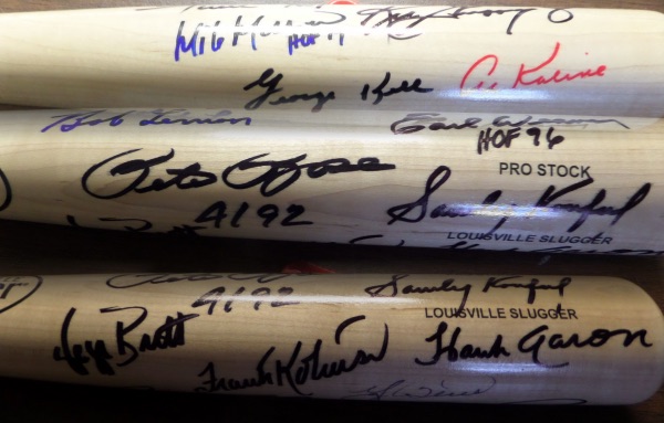 This blonde Louisville Slugger baseball bat is in NM condition, and comes hand-signed all around the barrel in red, black and blue by 13 all time greats.  Included are Rose, Koufax, Aaron, F. Robinson, Brett, Berra, Mays, Griffey Jr, Mussina, Kaline, Kell, Lemon and Weaver, and with only 4 of these men still alive, retail is thousands!