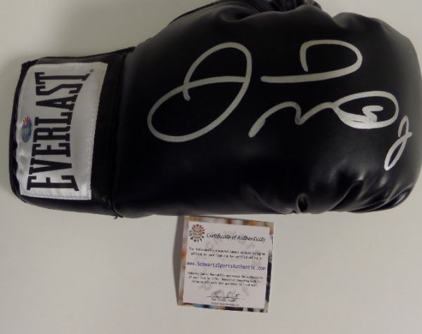 This mint black Everlast boxing glove is all leather and comes boldly silver pant pen signed by the Champ and future HOF'er. It shows off EZ from 40 feet away, value is middle hundreds, and a sought after Schwartz Sports lifetime COA accompanies. 