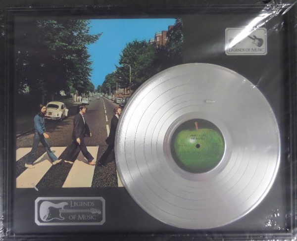 This 19x23 NM plaque display features a "platinum" Abbey Road record and a full color album print of all five band members!  100% display-ready, and certified by "Gold Record Outlet."  An awesome display, ideal for any music collection!