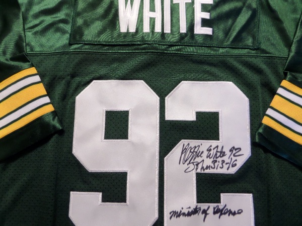 This green size 50 Packers 1993 throwback from Mitchell & Ness is still tagged as new, and comes with everything nicely sewn.  It is back number-signed in black sharpie by the all time great and HOF defensive end himself, grading about an 8.5, with John 3:16, 92, and Minister of Defense inscriptions.  With White's death now 20 years ago, retail is low thousands!