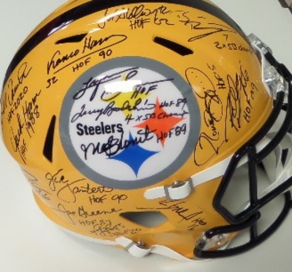 This yellow throwback Steelers full size replica helmet from Riddell is in NM condition, and comes black sharpie-signed by no less than 14 franchise legends!  Included are Terry Bradshaw, Franco Harris (dec), Ben Roethlisberger, Jerome Bettis, John Stallworth, Lynn Swann, Bill Cowhrer, Jack Lambert, Mel Blount, Joe Greene and more, and ALL of the signatures are on one side of the helmet to be shown off all at once.  Valued into the low thousands!