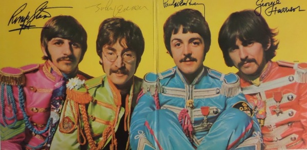 This vintage 1967 "Sgt. Pepper's Lonely Hearts Club Band" LP album is in EX overall shape, and opens to an image of The Fab Four against a yellow background.  It comes ink signed by John Lennon, sharpie signed by Paul McCartney, Ringo Starr and George Harrison, and looks absolutely GORGEOUS!!!  With half of the band now deceased, Paul next to impossible to get to, and Ringo no longer signing through the mail, retail is well into the thousands!