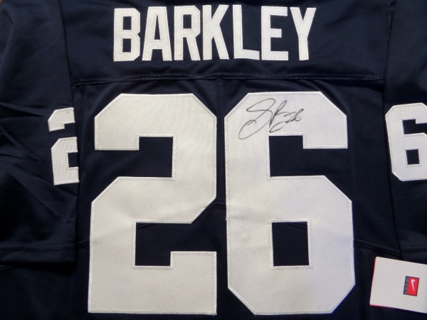 This mint and authentic PSU jersey is dark blue with white trim and GORGEOUS! It comes signed by this superstar wonderfully on his back numbers with his #26 included. Guaranteed authentic and ideal for the Penn State/Eagles fan and value in the high hundreds and rising. 