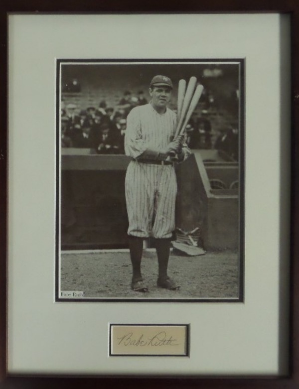 This pro framing job is amazing, double matted in black and white Yanks colors, wood framed to 11x14, and holds both a B&W 8x10 of the Babe, as well as a superb pencil signature matted right below. The autograph is a 1930's gem, grades a clean 9 all the live long day, and value is many times our opening bid price. 