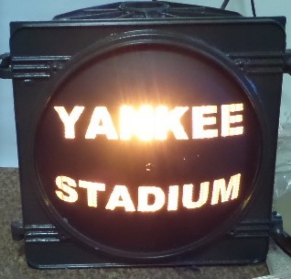 This attic find is a metal original, taken from the old beloved Bronx stadium and was used outside to control and direct Stadium traffic. It is heavy green painted metal, reads "Yankee Stadium" in the glowing lights, and yes, still works! One of a kind "obtained/taken" by our consignor when no one was looking, and valued at ???