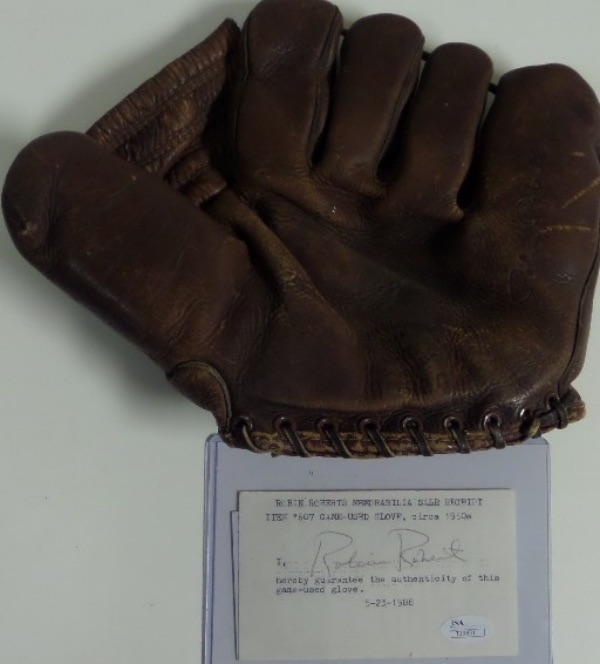 This well used pro model glove is a dark brown leather, lays flat, and was used, according to the late HOF pitcher, in his 1950's "Whiz Kids" HOF heyday. A 1988 hand signed note, fully JSA approved and hologrammed accompanies for iron clad authenticity, and value of this historic  Phillies Cooperstown relic is ???