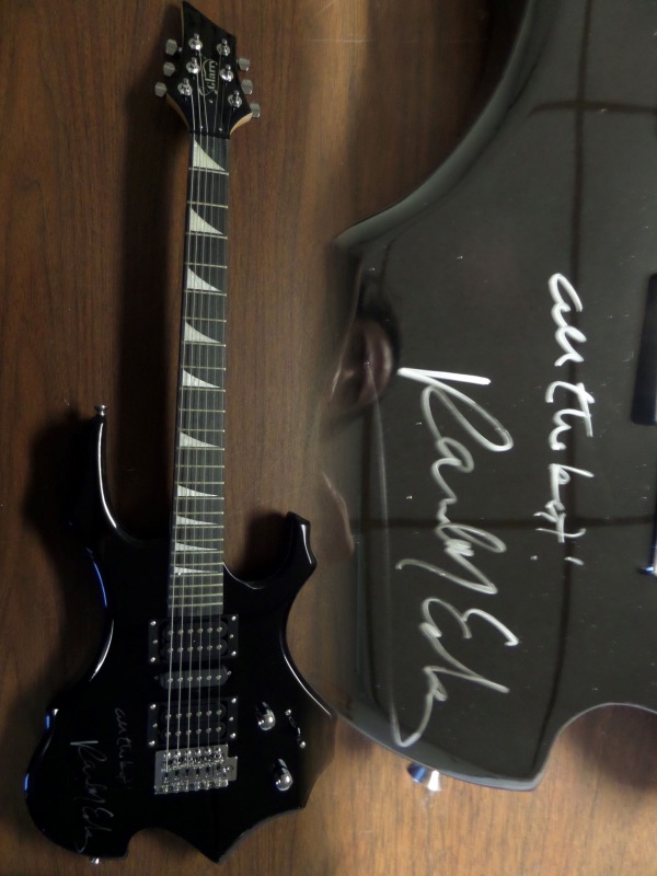 This gorgeous mint electric Glarry guitar comes with the original box, pick ups, bag, straps,etc. and comes signed by the best singer/songwriter of all time in black. SUPERB autograph and shows off wonderfully. Guaranteed authentic and get it now because Paul is a tough autograph and not getting any younger! He even included "All the best" above his tough-to-get signature!