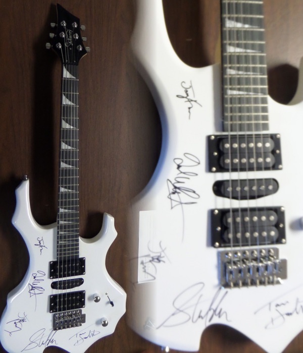 This mint GORGEOUS electric guitar comes body signed by all five members of this iconic hard rock band!  Included are Hamilton, Kramer, Perry, Tyler and Whitford, all in bold black sharpies, and this baby will show off in Hard Rock Cafe style!  Valued into the low thousands+++ and comes with original carry case, bag, pick ups etc.. WOW Guaranteed authentic. 