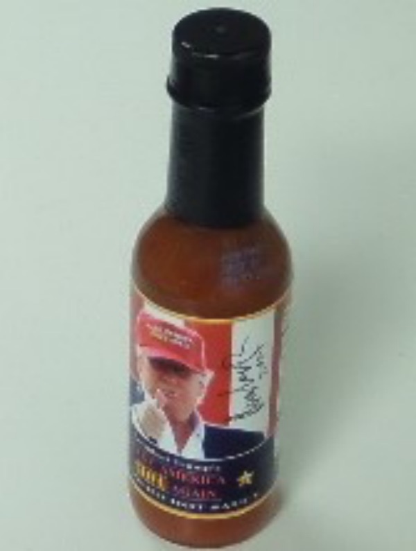 This full sealed bottle of President Trump's Make America HOT Again hot sauce is in NM condition, and comes hand-signed in black sharpie by 45 himself.  The signature grades an overall 8.5, complete with a 2024 inscription added, and retail is high hundreds!