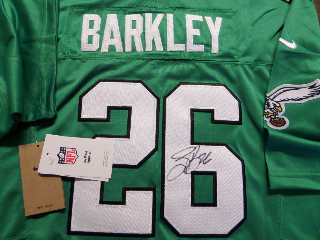 This mint authentic kelly green Eagles jersey comes signed by the newest Eagles RB superbly on his back numbers with #26 included!  Great jersey from this All-Pro and retail is shooting up fast as Philly is poised again for a Super Bowl run!  Guaranteed authentic and Saquon having monster year!!