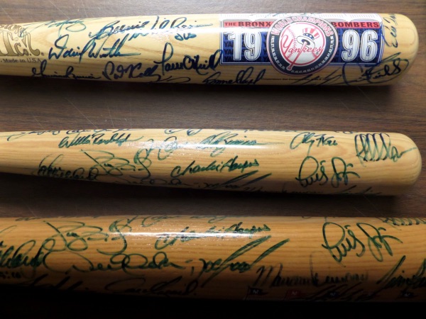 This beautiful 1996 New York Yankees commemorative bat from The Cooperstown Bat Company is still in NM condition, and comes blue sharpie-signed all over the barrel by more than 25 members of this unlikely World Champion squad!  Included are HOF names like Jeter, Rivera, Boggs, Raines, and Torre, as well as All Star names like O'Neill, Williams, Rogers, Key, Pettitte, Cone, Wells and many more.  AWESOME Bronx Bombers item, and a wonderful memento from a legendary season!