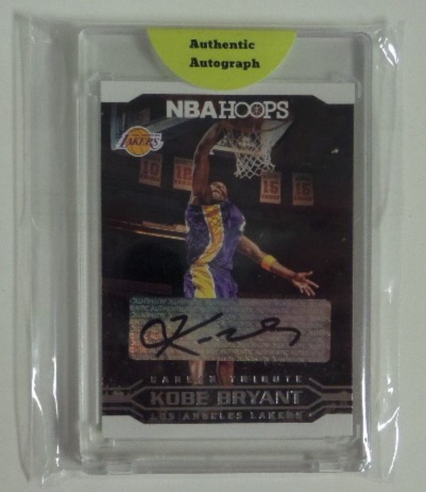 This mint color card shows Kobe in mid-dunk, wearing his LA road purple uniform, and features a perfectly signed spot across the front. It grades a clean bold 10 all over, comes sealed by Panini for lifetime certainty, and is guaranteed an "authentic autograph" by that seal..Wow!!