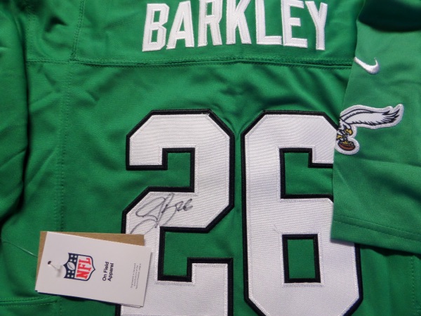 This mint authentic kelly green Eagles jersey comes signed by the newest Eagles RB superbly on his back numbers with #26 included!  Great jersey from this All-Pro and retail is shooting up fast as Philly is poised for a Super Bowl run!  Guaranteed authentic and Saquon having monster year and broke 2k rushing yards!