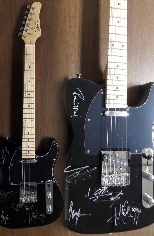 This mint black electric guitar is a beauty, comes base signed by all FIVE band mates, and shows off EZ from 30 feet away. Of course Mick, Keith, Ronnie, Bill and the just deceased Charlie are here, and value is thousands! 