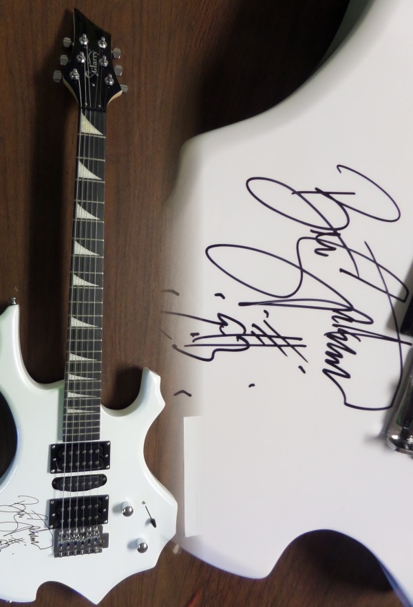 This mint white electric beauty comes in the original box with accessories/carry bag included. It comes signed PERFECTLY by this legend in black sharpie with a hand drawn picture of a guitar added by the Boss!!!  Guaranteed authentic and as nice as you will ever see from Bruce! Retails into the thousands.
