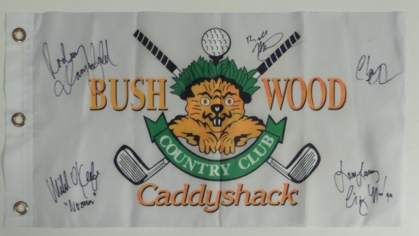 This white "Bushwood Country Club" pin flag from the movie Caddyshack has been black marker signed by 5 cast members, including Chevy Chase, Bill Murray, Michael O'Keefe, Cindy Morgan, and the late Rodney Dangerfield.  All signatures grade 9's or better on this piece that is a must have for fans of the classic comedy, and values into the high hundreds and nice! A few even included their character names!