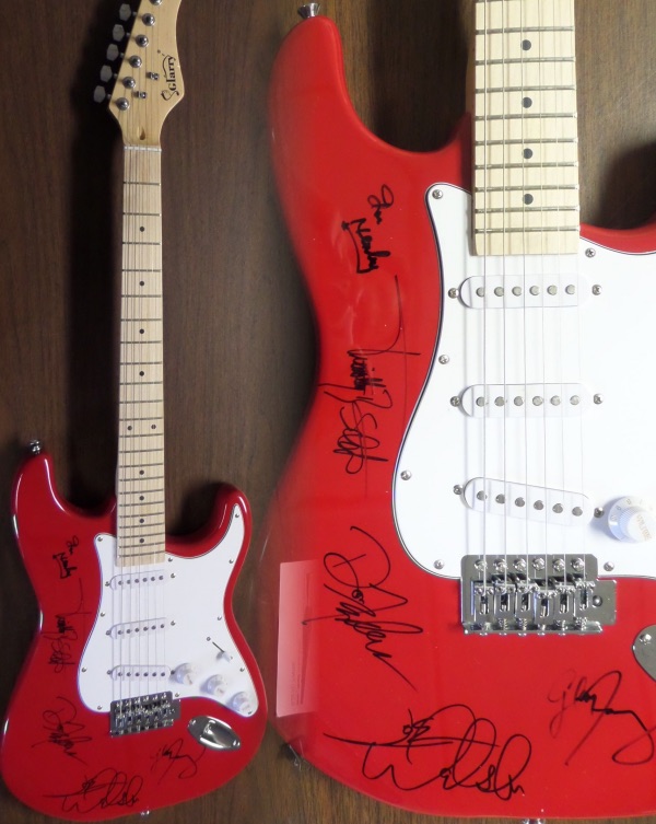 Wow, this mint and great-looking red strat-style electric guitar comes signed 5 of the longtime members of this amazing rock band. The signatures all show off wonderfully on this gorgeous guitar and included are JOE WALSH, GLENN FREY (deceased), DON HENLEY, TIMOTHY SCHMIT, & DON FELDER!!  Very rare with Frey's signature and retails into the thousands easily. Guaranteed authentic. 