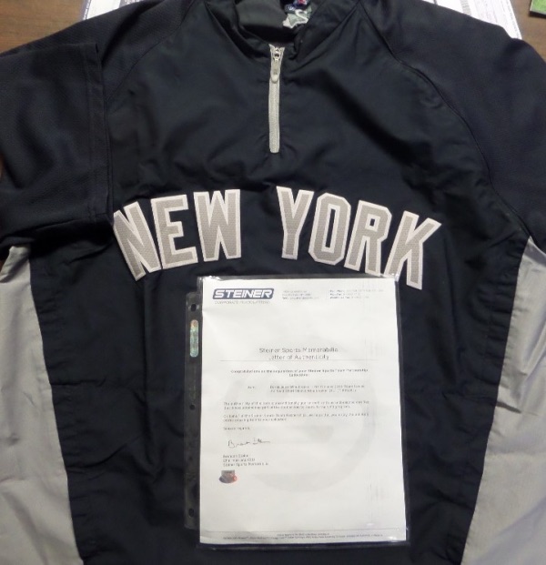 This navy blue road short sleeve windbreaker was issued to Yankee Captain Derek Jeter in the 2011 Season.  It is an XL from Majestic, with NEW YORK sewn across the chest, and is not only affixed with an MLB hologram (FJ896281), but is also fully STEINER certified (05948) for rock solid authenticity.  A truly one of a kind NYY item, and retail is low thousands!