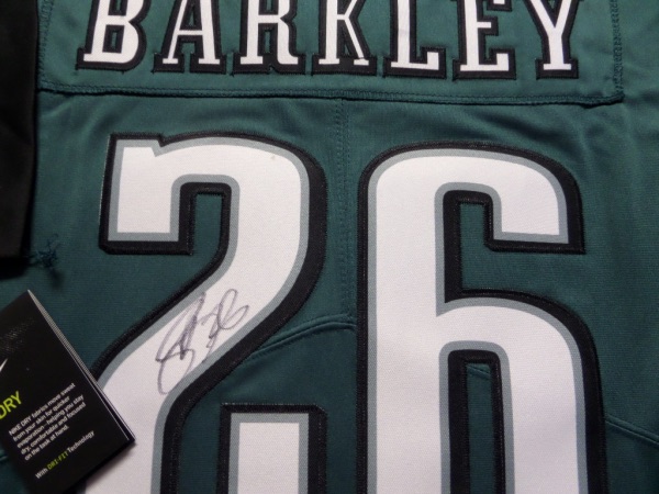 This mint authentic dark green Eagles jersey comes signed by the newest Eagles RB superbly on his back numbers with #26 included!  Great jersey from this All-Pro and retail is shooting up fast as Philly is poised to win the Super Bowl as I am typing this in!  Guaranteed authentic and Saquon having monster year and broke 2k rushing yards!