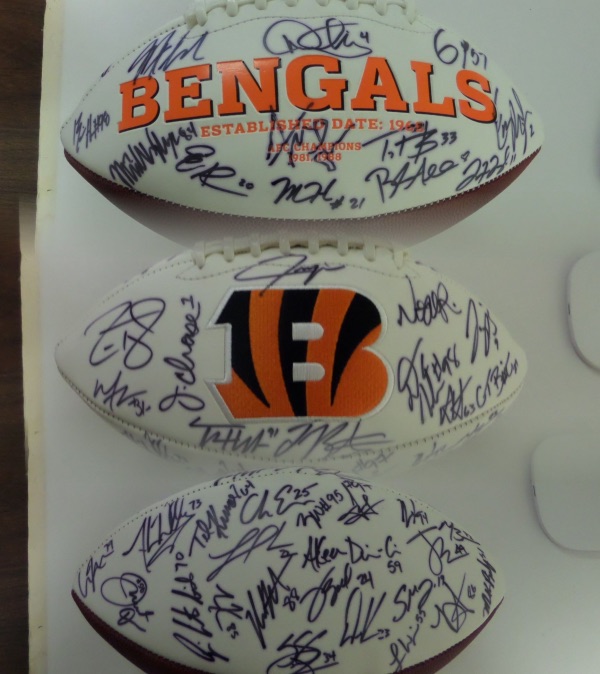 We didn't even have one of these when the Bengals were in the Super Bowl, but we do now!  It is a triple white panel football, with a Bengals logo embroidered on one side of the laces, and team championship info on the other.  It is hand-signed in black sharpie by more than 35 members of this AFC Champion squad, including Joe Burrow, Jamarr Chase, Joe Mixon, Trey Hendrickson, Jesse Bates, and every other big name on this team.  An absolute MUST for Bengals fans, and retail is low thousands!