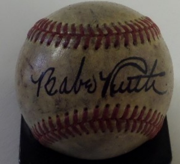 This well used ball is red-laced, comes black ink, sweet spot signed by the Babe, and shows off easy from 20 feet away. The ball may be handled and used, but the signature is a 15 on a 1-10 scale...simply perfect, bold and stunning! Don't look for better, or more authentic. 