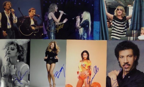 This high value grouping is TWENTY celeb 8x10's, and each is autographed by the superstar(s) shown. Lots of music stars here, and included are names like Simon & Garfunkel, Stevie Nicks, Madonna, Beyonce, Taylor Swift and Avril Lavigne together, Hank Williams Jr, John Stamos/Lori Laughlin, Emmanuelle Chriqi, Kristin Wiig, Fergie, and more.  Sky high retail potential here!