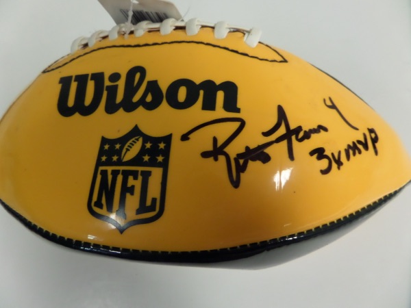 This dark green and yellow football from Wilson still has original tagging affixed, is in EX/MT condition, and features both Packers and NFL logos.  It is hand-signed in black sharpie by the HOF quarterback himself, grading an 8, and including 4 and 3XMVP inscriptions, and retail is mid/high hundreds!