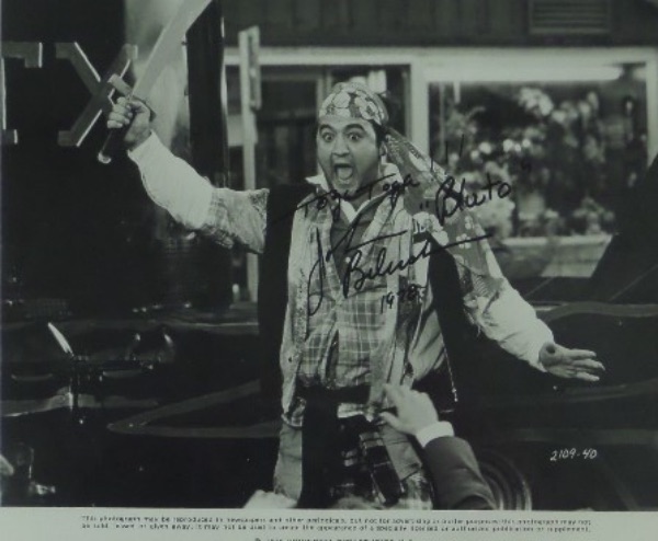 This black and white movie publicity photo is for 1978's comedy classic, "Animal House," with an image of John Belushi's Bluto character dressed as a pirate for the movie's conclusion.  It is hand-signed in black sharpie by the legendary comedian and actor, grading a 9, with Toga Toga!!!, 1978 and "Bluto" inscriptions, and with his tragic death only 5 years after this was signed, retail is low thousands!  Selective Resources, Inc. COA included!