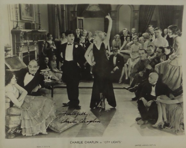 This very old black and white 8x10 shows a dance scene from the 1931 Charlie Chaplin classic, "City Lights."  It is hand-signed in black by the silent film icon and Hollywood legend himself, grading a strong 9, with a Faithfully inscription.  Any film collection would be greatly enhanced with the addition of this jewel, and, with Chaplin deceased now just short of a half century, retail is low thousands!!!