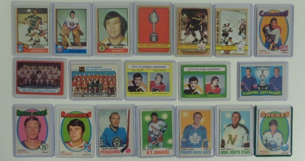 This SUPER Lot of 125 Hockey cards from 1970's includes OPC and Topps and ALL in Top Loaders with STARS galore included. I see Espo, Salming, Savard, Worsley, Clarke, Gilbert, Hextall, Dionne and MANY More.  This is a HIGH $$$ lot from 1970's and ALL in Top Loaders and overall Great condition.