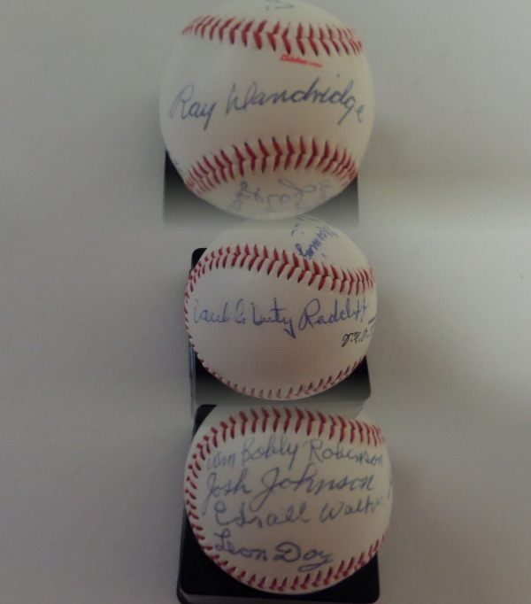 This Negro League Museum logo baseball has Buck O'Neil as the Chairman on it. It is in NM shape and comes signed in blue inks by 8 heroes of this legendary league. Included are Ray Dandridge (sweet spot), Monte Irvin, Leon Day, Double Duty Radcliffe, Max Manning, B.Robinson,J.Johnson, & E.Walker.  Comes with a full JSA COA and also a Joe Dimaggio Estate COA for guaranteed authenticity. 