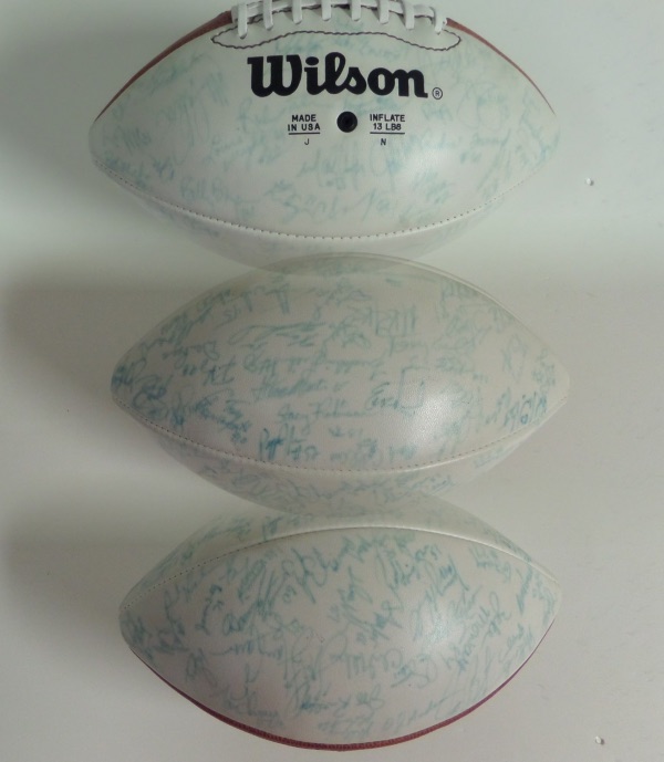 This Wilson Official Super Bowl 21 triple white panel ball comes signed in blue by around 70 members of both the GIANTS and the BRONCOS!  Included are SIMMS, ELWAY, OJ ANDERSON, HARRY CARSON, DAN REEVES, ETC.  Sig's are in VG shape overall as they have faded a bit in blue, but still 100% authentic and comes fully certified by JSA for authenticity purposes. 